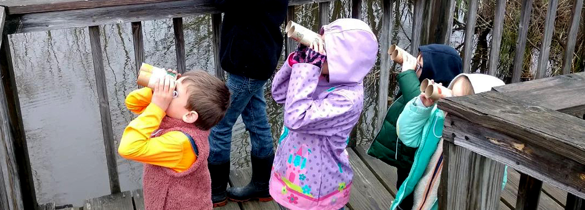 Slideshow Image - Children using craft binoculars made from cardboard toilet paper tubes