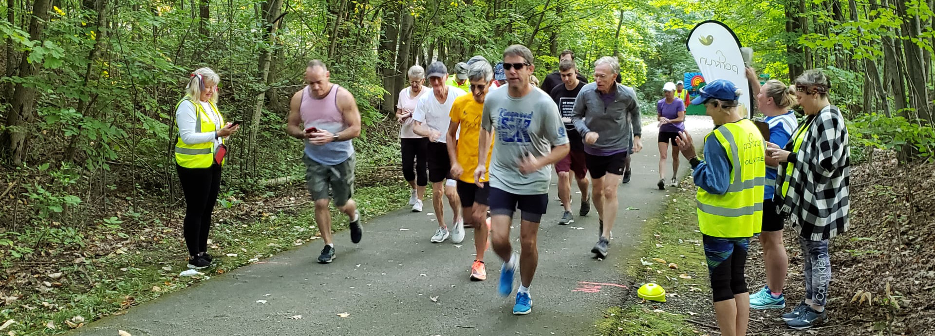Slideshow Image - An employee showing a Grey Ratsnake to a group of children