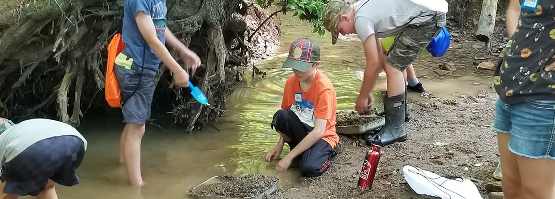 Slideshow Image - Boy scouts studying erosion in the GNC stream