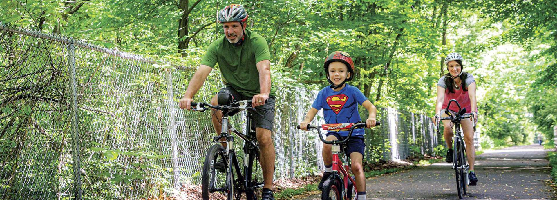 Slideshow Image - A small family biking on the B&O trail