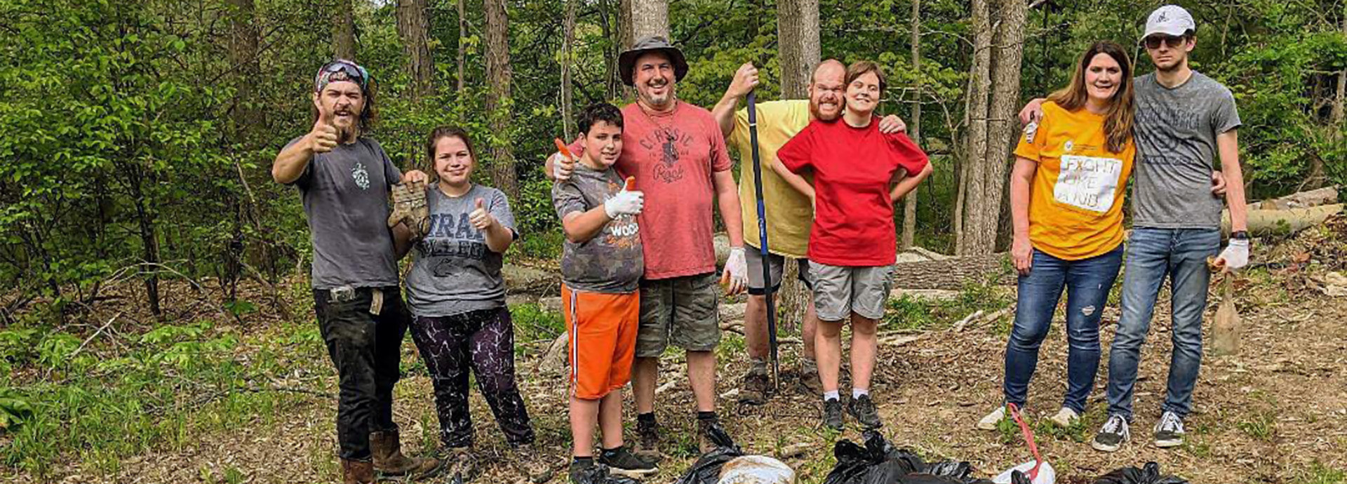 Slideshow Image - A group of volunteers helping pull invasive plants