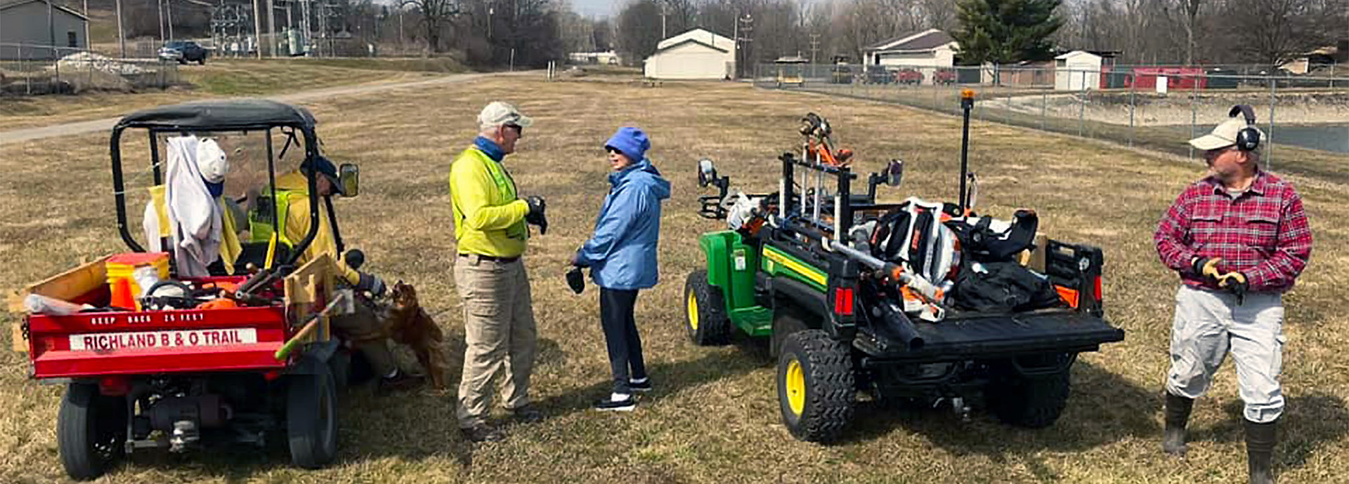 Slideshow Image - Volunteers performing maintenance on the B&O trail